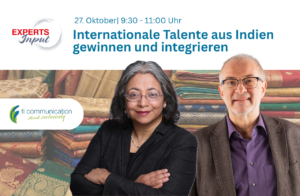 Sujata Banerjee und Gerhard Hain mit orientalischen Stoffen im Hintergrund