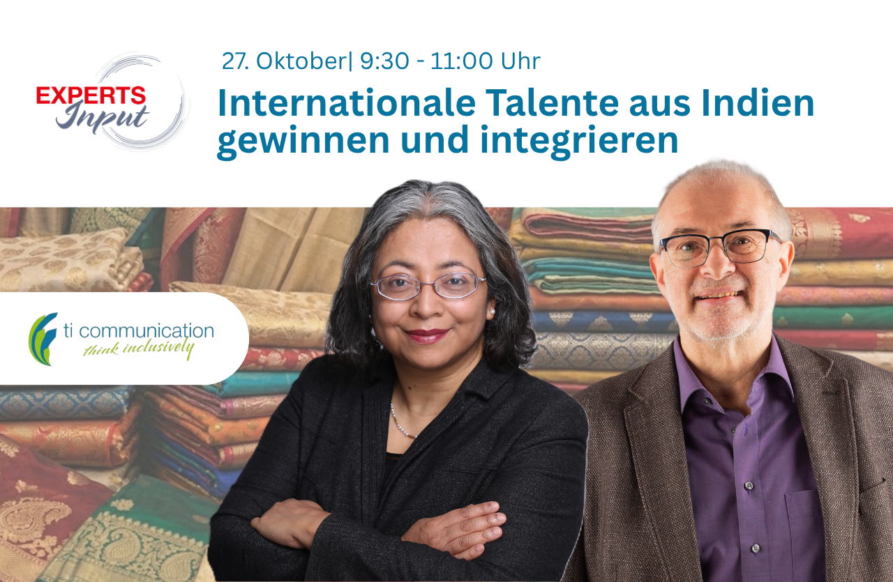 Sujata Banerjee und Gerhard Hain mit orientalischen Stoffen im Hintergrund
